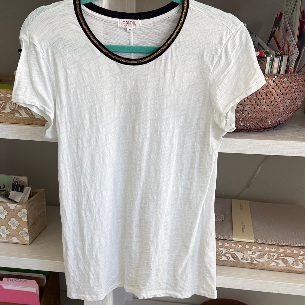 Goldie White Tee with Black and Gold Accents. Size Medium.